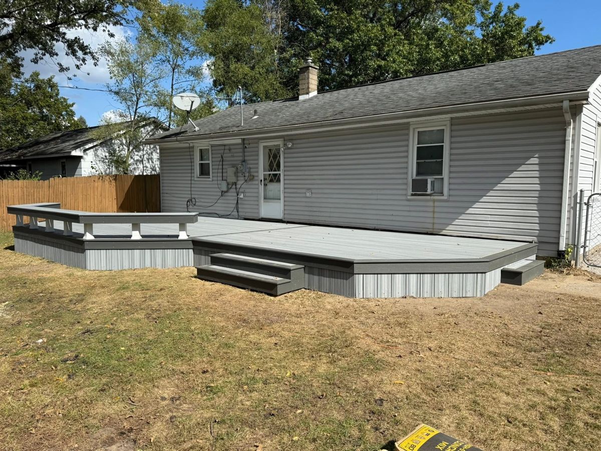 Deck with built-in bench seating and outdoor kitchen