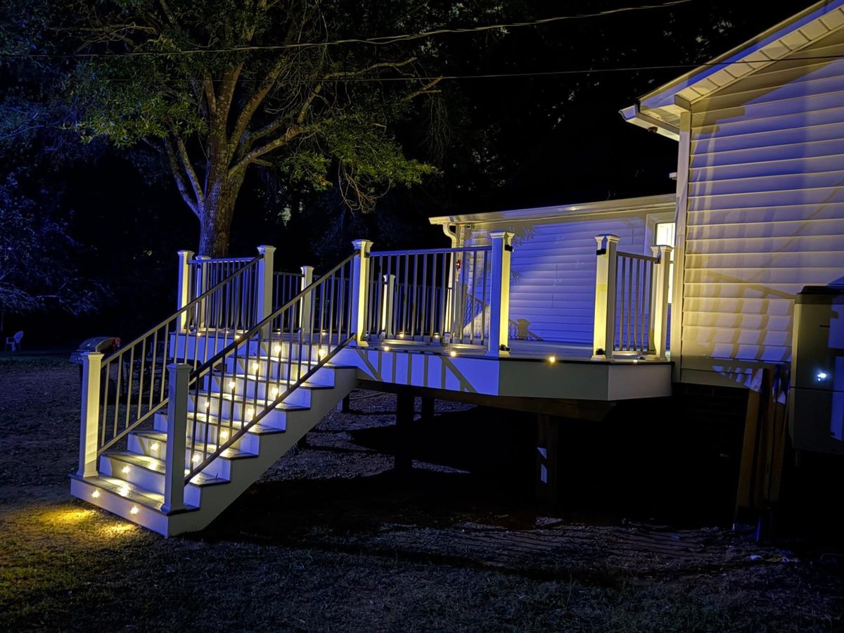 Composite deck with built-in railing and steps
