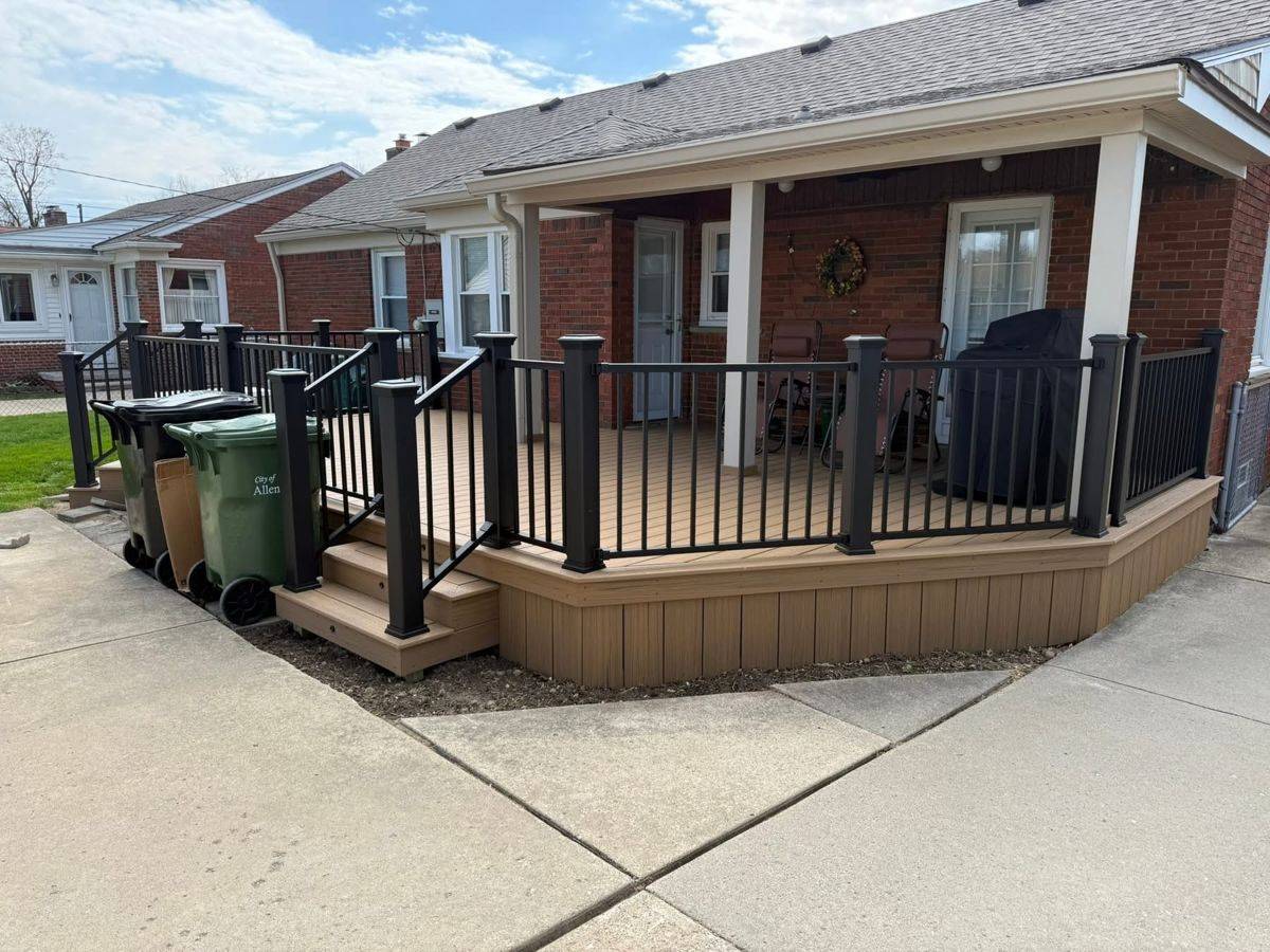 Covered front porch deck with black railings