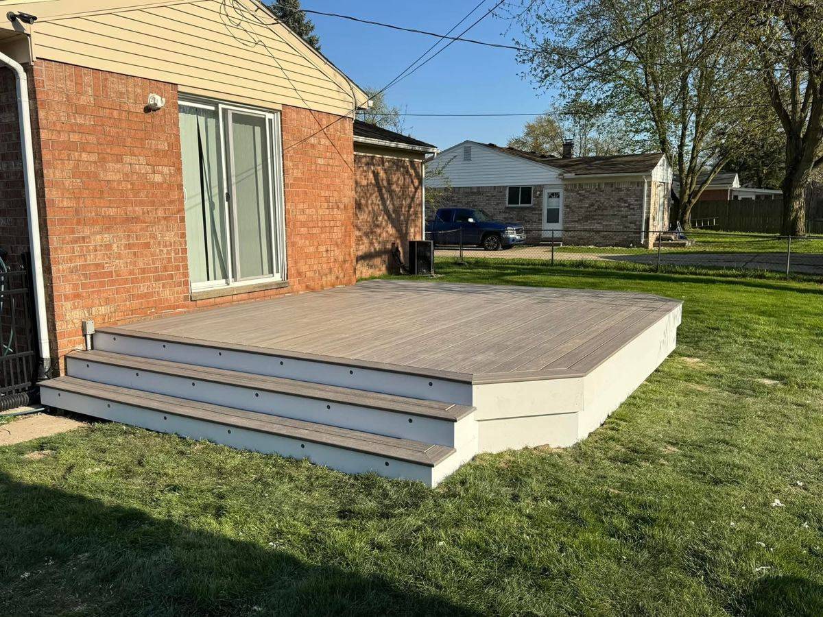 Elevated composite deck with built-in steps
