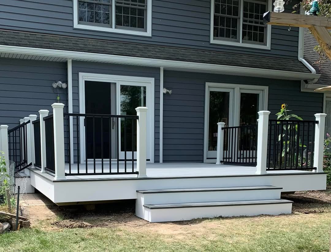 Modern deck with black railings and white trim